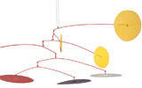 Alexander Calder, I tre soli gialli (Les Trois soleils jaunes), 1965 | Mobile, metallo, cm 150 x 400 | Saint-Paul de Vence, Fondation Marguerite et Aim Maeght |  foto Archives Maeght